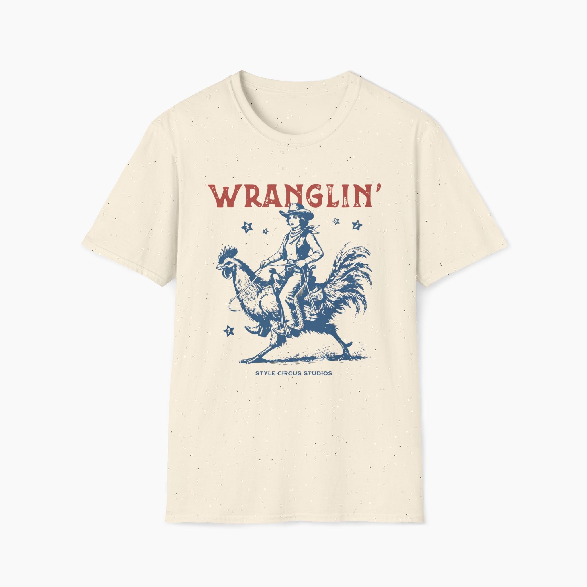 Beige t-shirt with a graphic of a cowboy and rooster and the word 'WRANGLIN' on a white background.