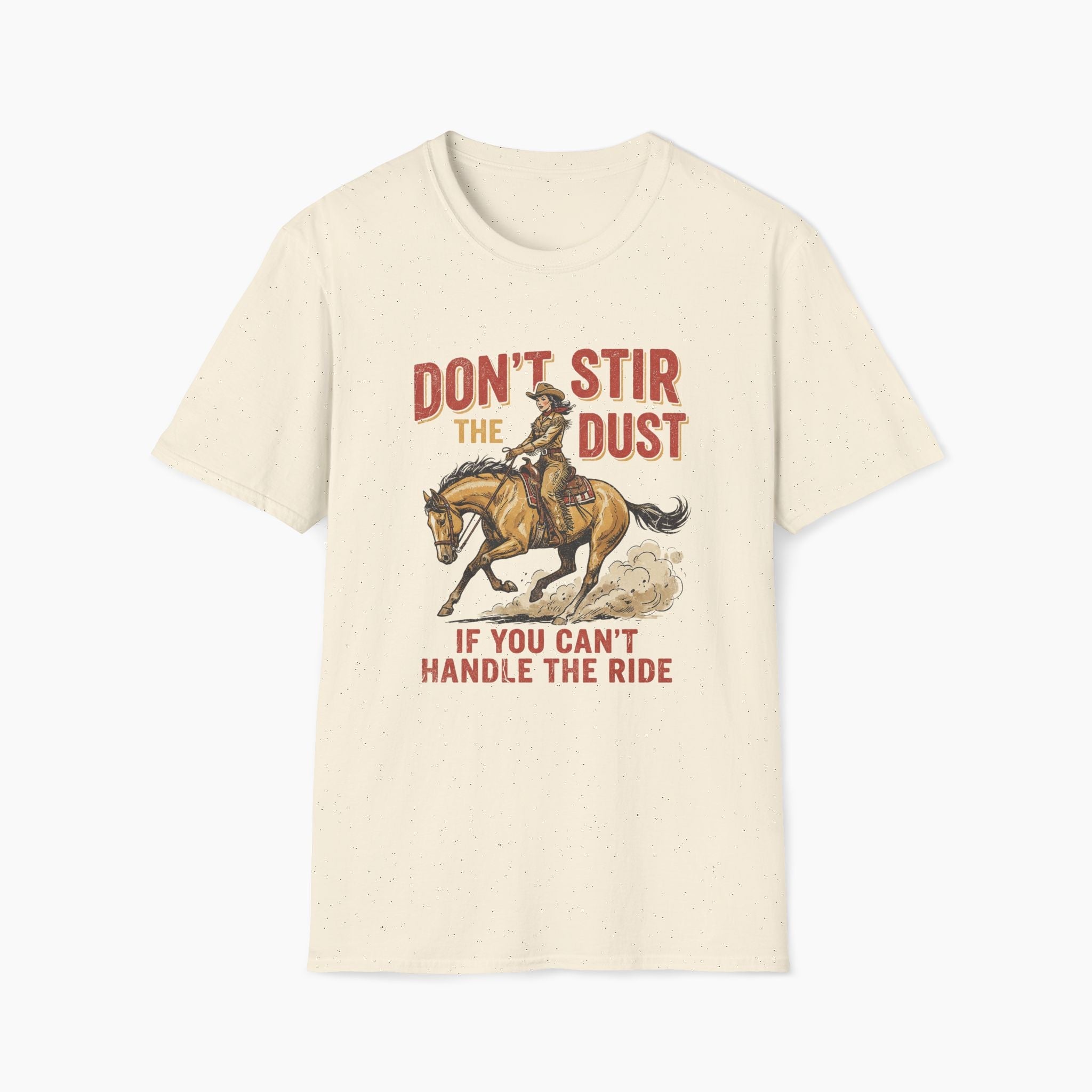 Beige t-shirt with a graphic of a cowboy on a horse and text 'Don't stir the dust if you can't handle the ride' on a white background.