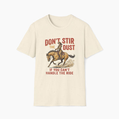 Beige t-shirt with a graphic of a cowboy on a horse and text 'Don't stir the dust if you can't handle the ride' on a white background.
