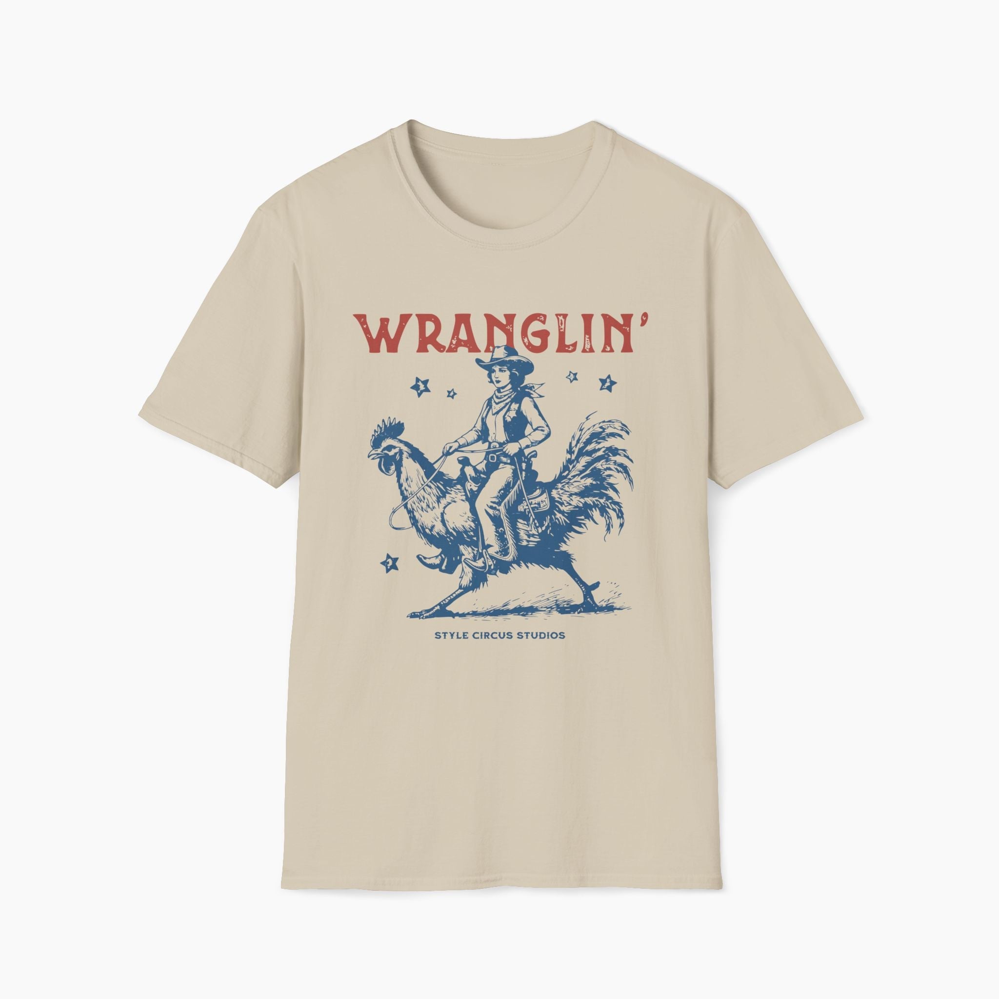 Beige t-shirt with a graphic of a cowboy riding a rooster and the word 'WRANGLIN'' on a white background.